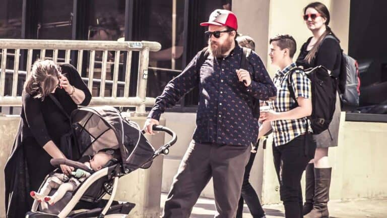 person pushing baby stroller
