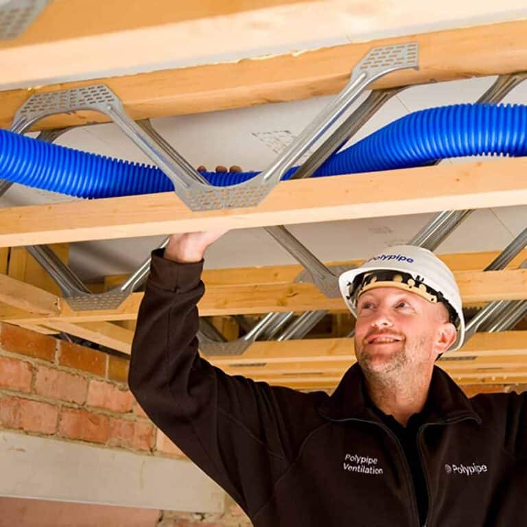 man installing ducting