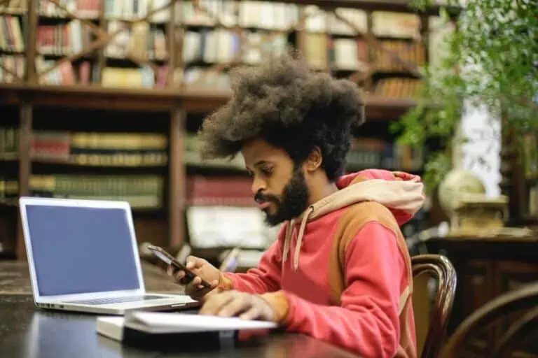 man in pink long sleeve shirt doing research 3966555