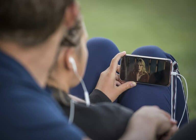 person watching video on phone