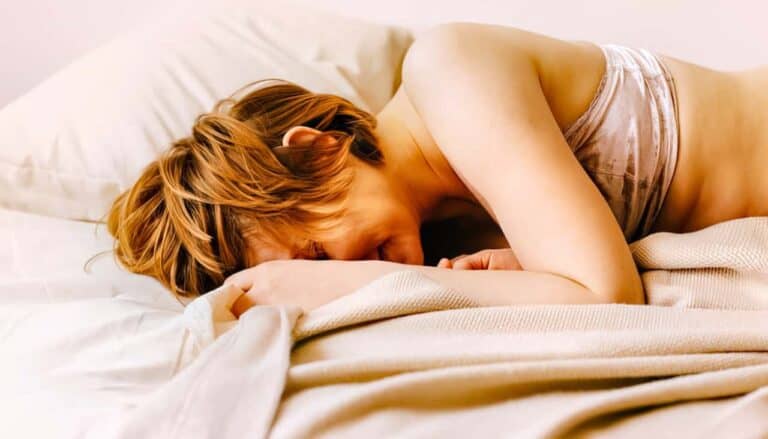 woman smiling in bed