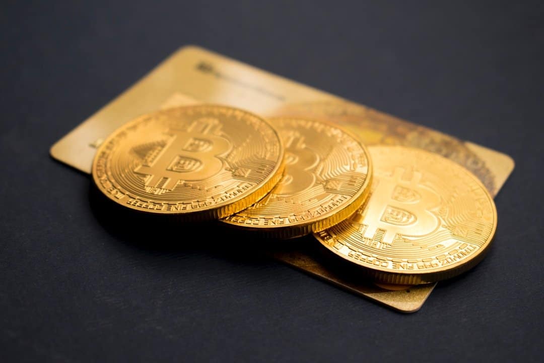 3 Characteristics of a High-Quality Crypto Credit Card 2 bitcoins on table