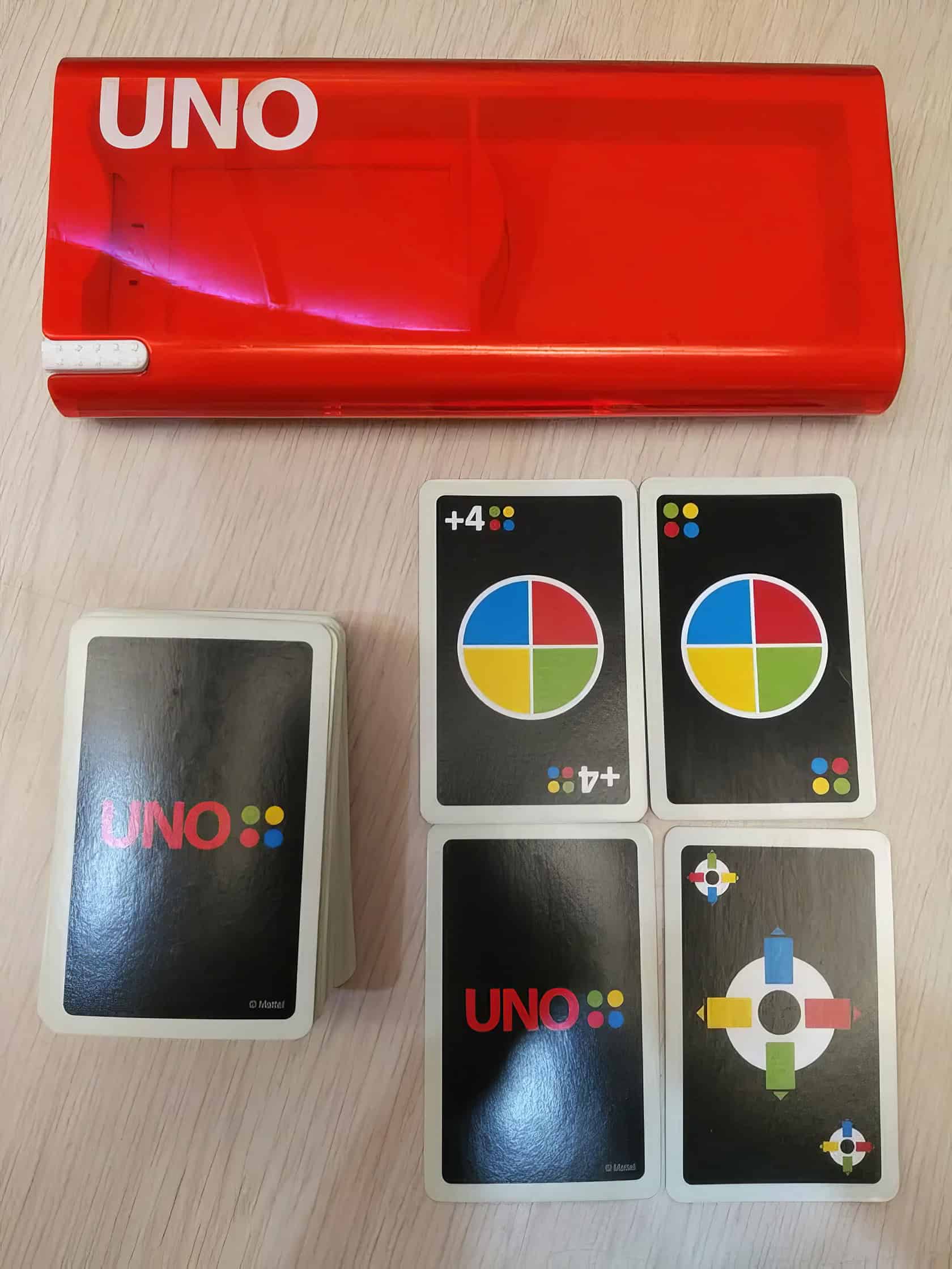 A man in his thirties plays Uno Mod in a cozy living room. Uno Mod Game 2
