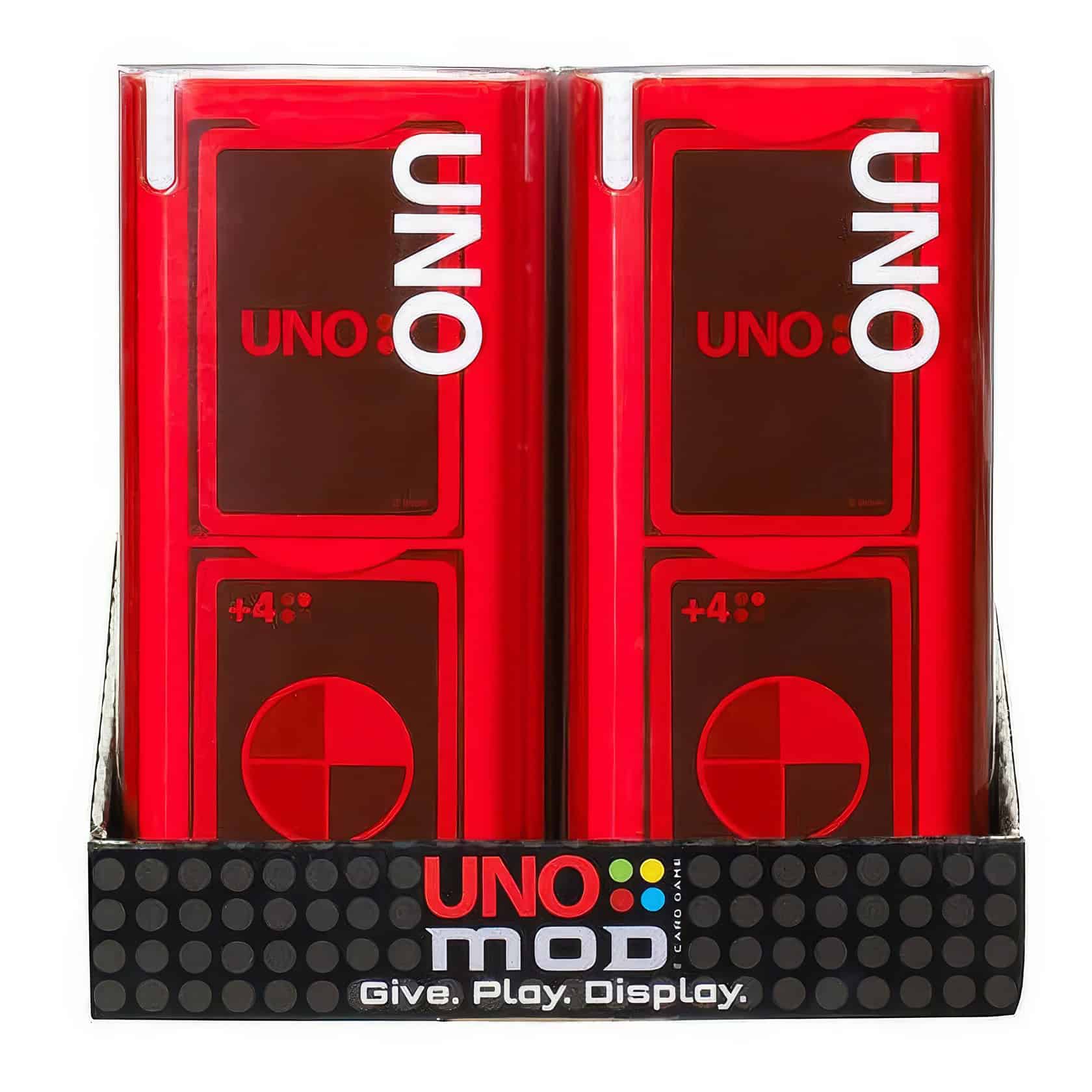 A man sits at a wooden table, focused on a game of Uno Mod. Uno Mod Game 5