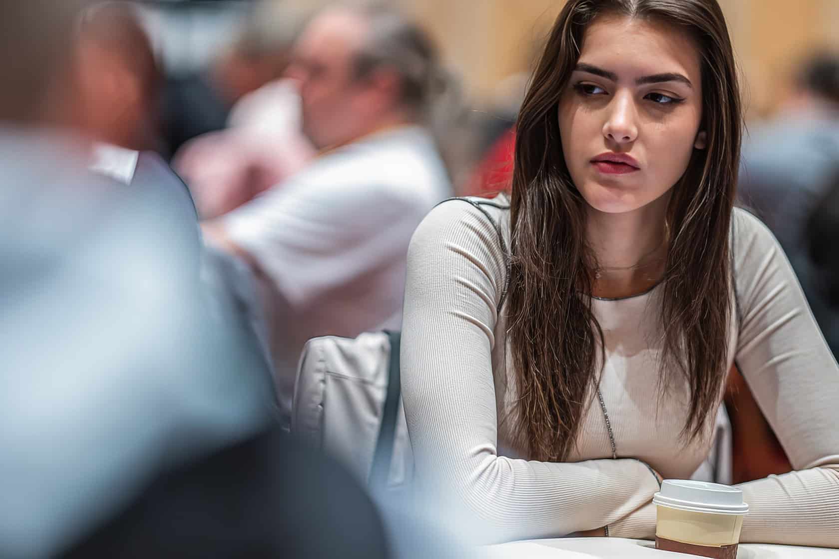 A focused young man shifts from strategizing chess to bluffing in poker, embodying concentrated skill and confidence. Alexandra Botez Poker 1