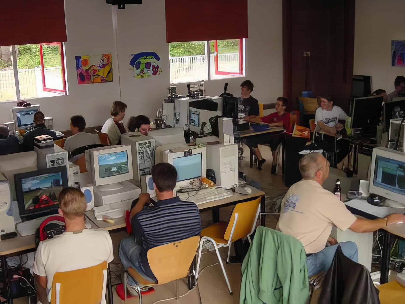 A cluttered gaming desk displays various professional audio equipment and headsets, creating a personalized and functional setup. What Do You Need for LAN Party Fun 9