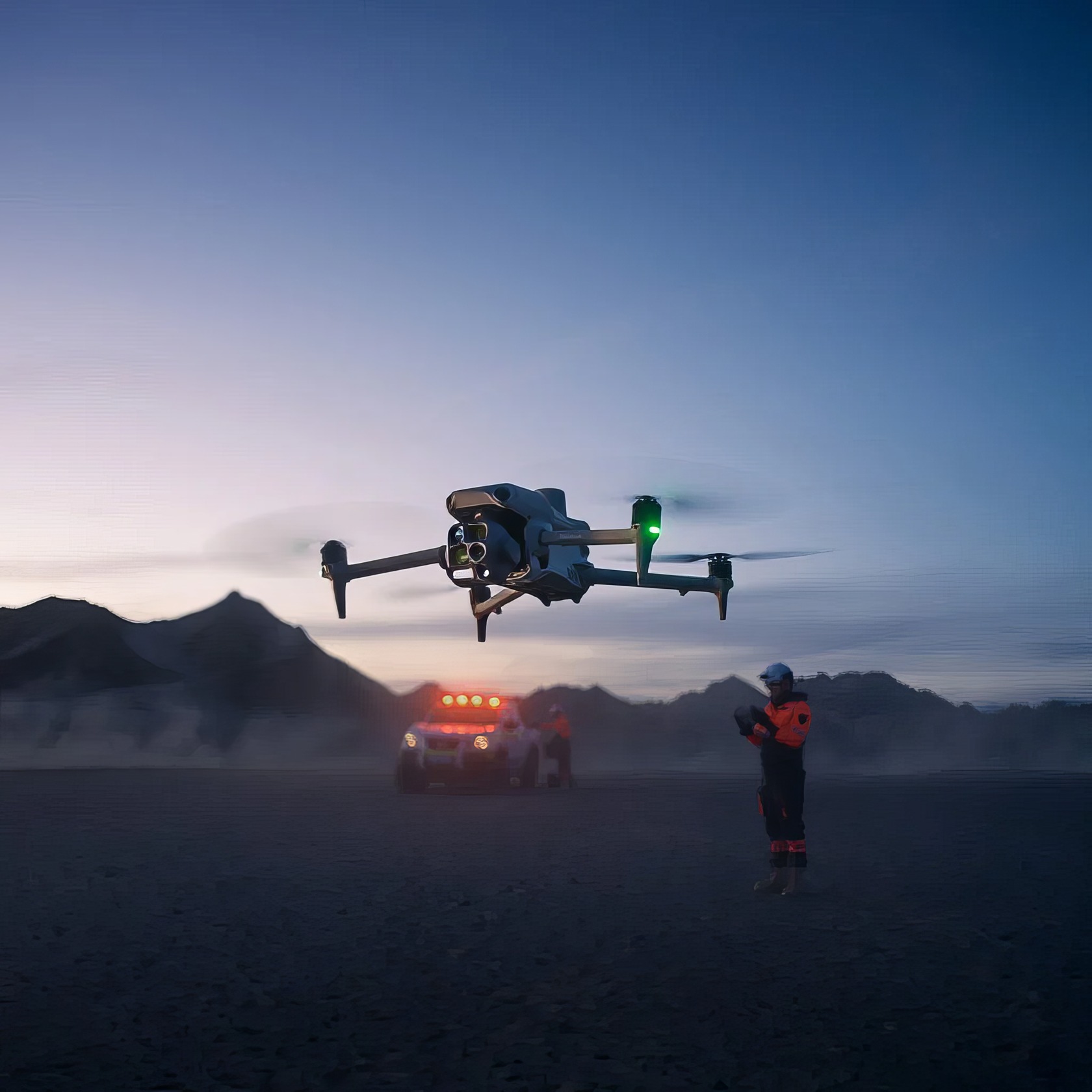 A DJI Matrice 4T drone hovers over a casual outdoor area with trees, grass, and distant houses. A professional drone operator with a drone flying at dusk over desert terrain, with emergency vehicle in the background, showcasing advanced drone technology and remote piloting for security and exploration.