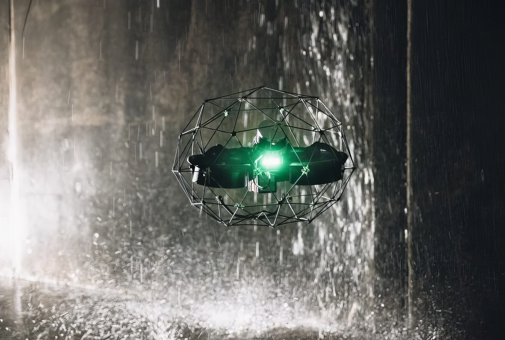 A candid shot captures an ELIOS 3 quadcopter flying through a cluttered indoor space with a nearby person. High-tech drone with protective cage flying in rain, showcasing advanced aerial technology and waterproof design for outdoor use.
