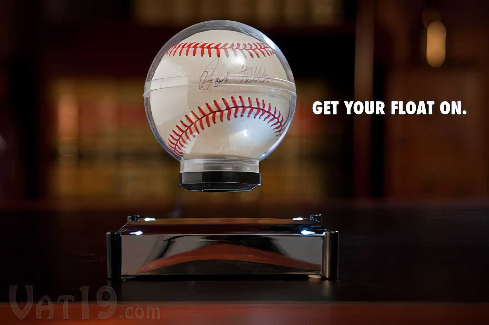 Levitron Revolution Ez Float: The Magical Floating Device 1 Floating baseball with a clear display case and the text "GET YOUR FLOAT ON." on a dark background.