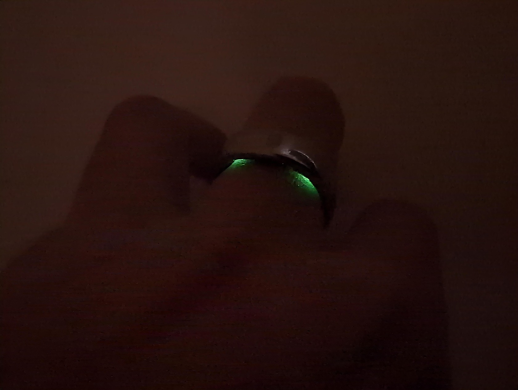 RingConn Gen 2 Air Review: 10 Reasons to Buy or Skip in 2025 5 Pixelated dark image with faint green glow, difficult to identify objects or scene.