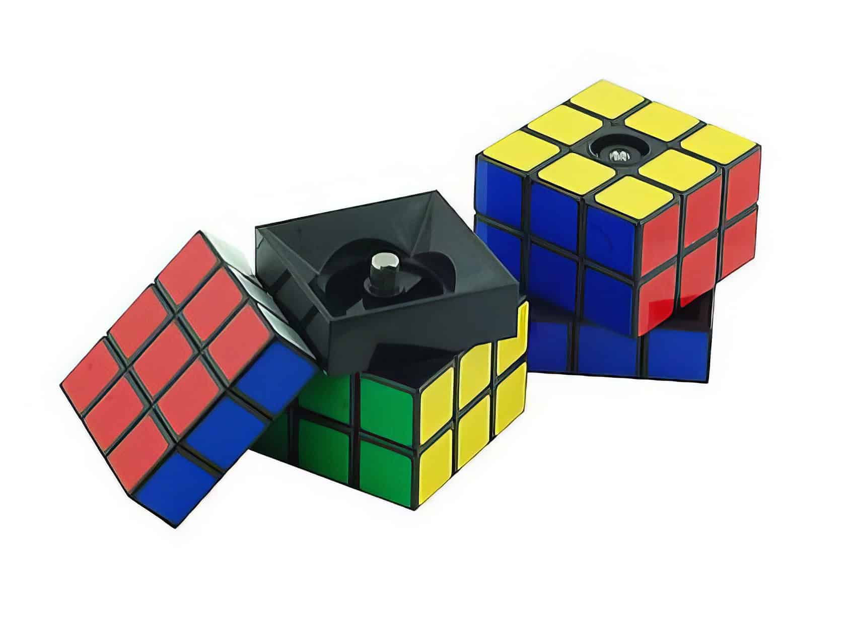 Colorful rubik's cubes and a black turn mechanism for speedcubing on a white background.