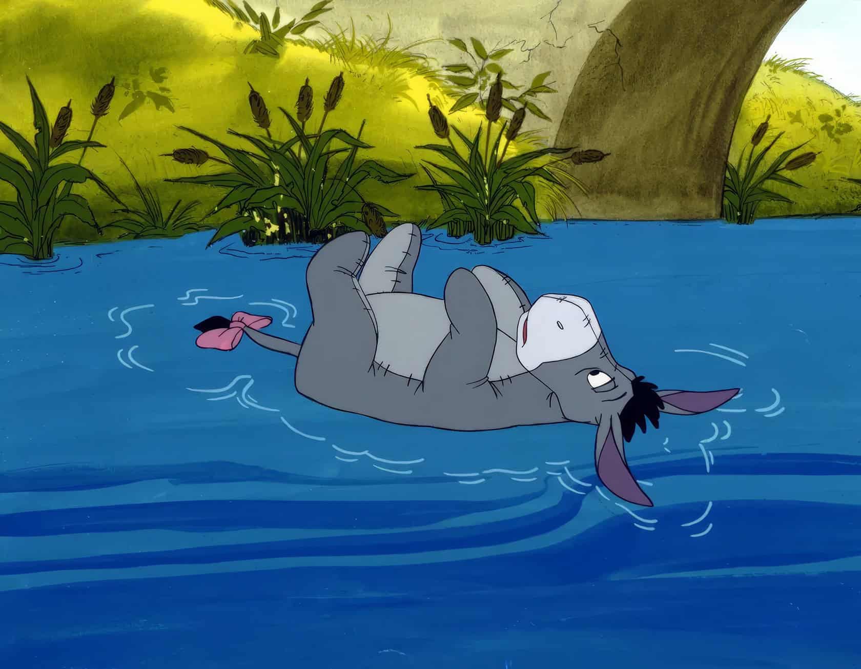 Depression in Cartoons: 12 Key Lessons from Eeyore to BoJack 4 Floating grey cartoon mouse lying on water with a bandage on head, surrounded by greenery and trees, vibrant outdoor scenery, animated style.