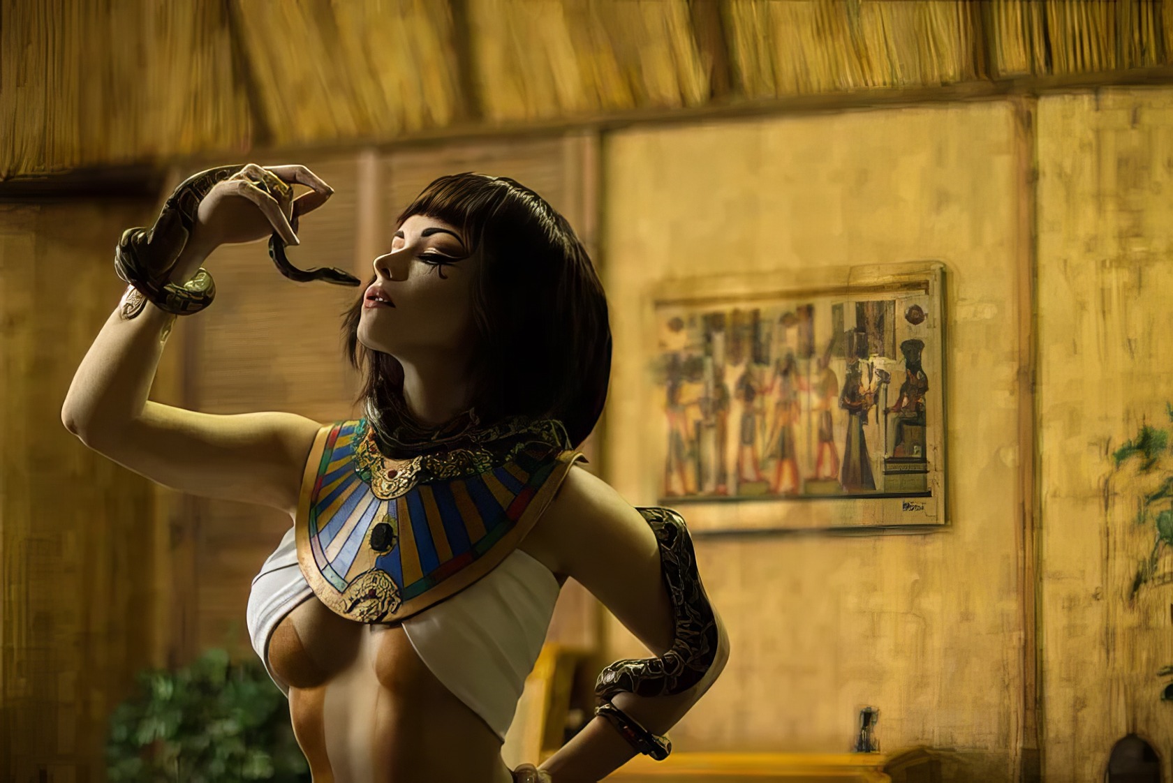 Assassin's Creed Hot Cosplay: 20+ Character Costumes & DIY Tips 21 Intriguing woman in Egypt-inspired costume with snake accessory at an art gallery or museum setting.
