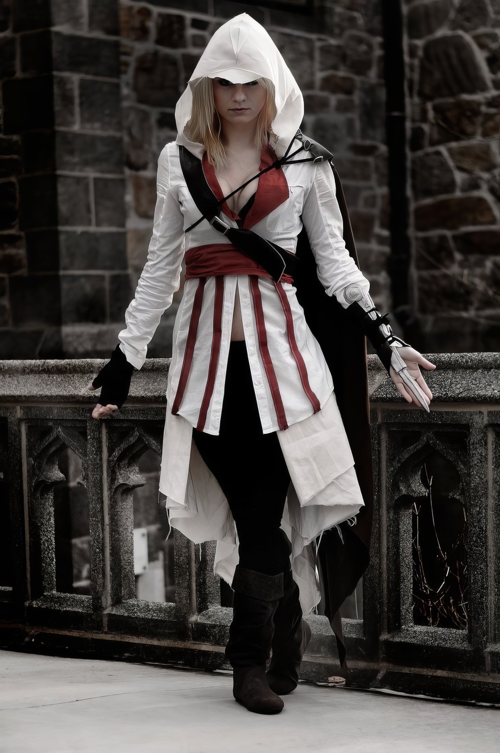 Assassin's Creed Hot Cosplay: 20+ Character Costumes & DIY Tips 16 Assassin's Creed cosplay woman in detailed costume on a city balcony, wearing a hood and medieval-style outfit for gaming and cosplay events.