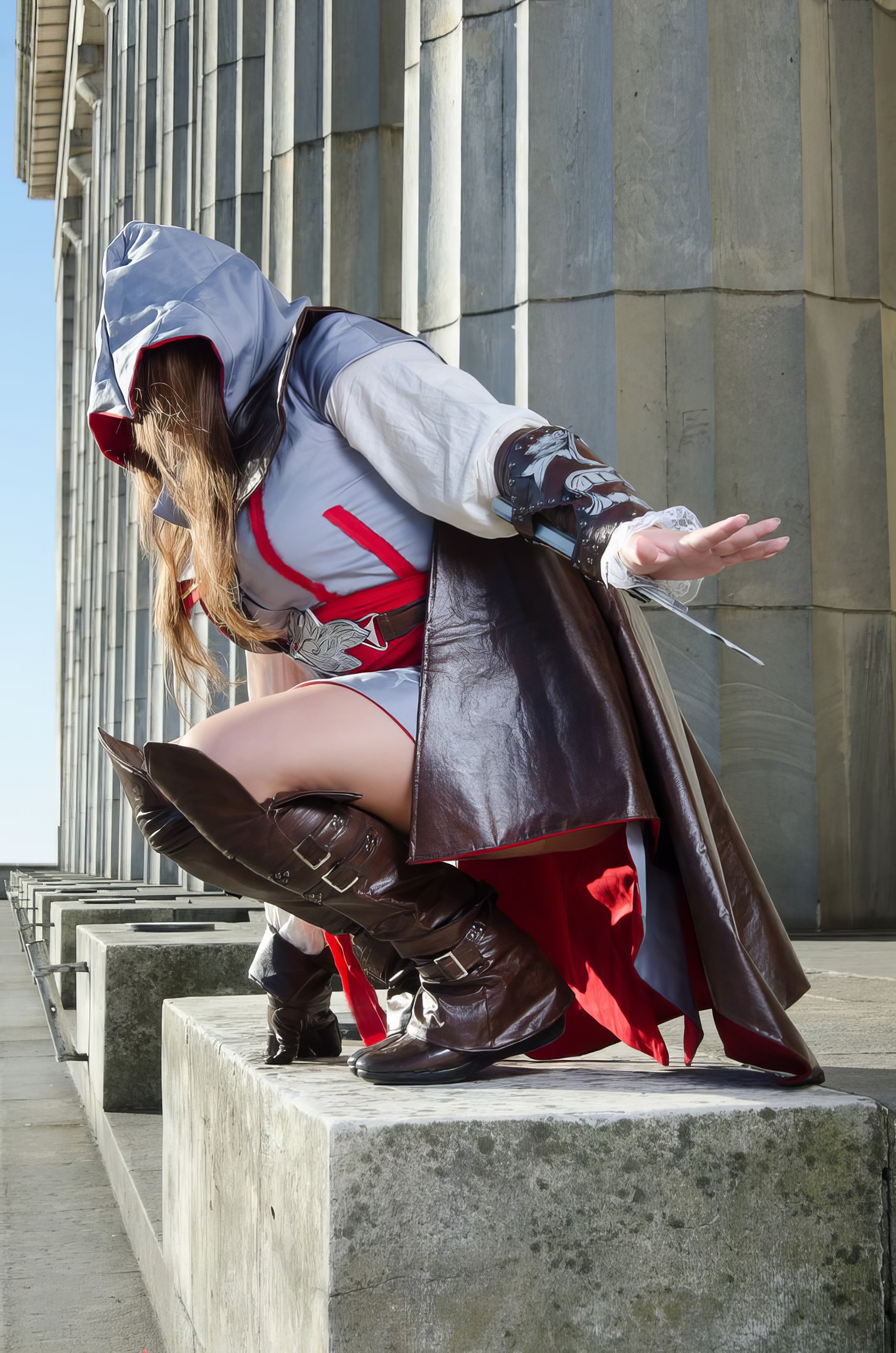 Assassin's Creed Hot Cosplay: 20+ Character Costumes & DIY Tips 3 Stealthy cosplayer in detailed Assassin's Creed costume crouching outdoors.