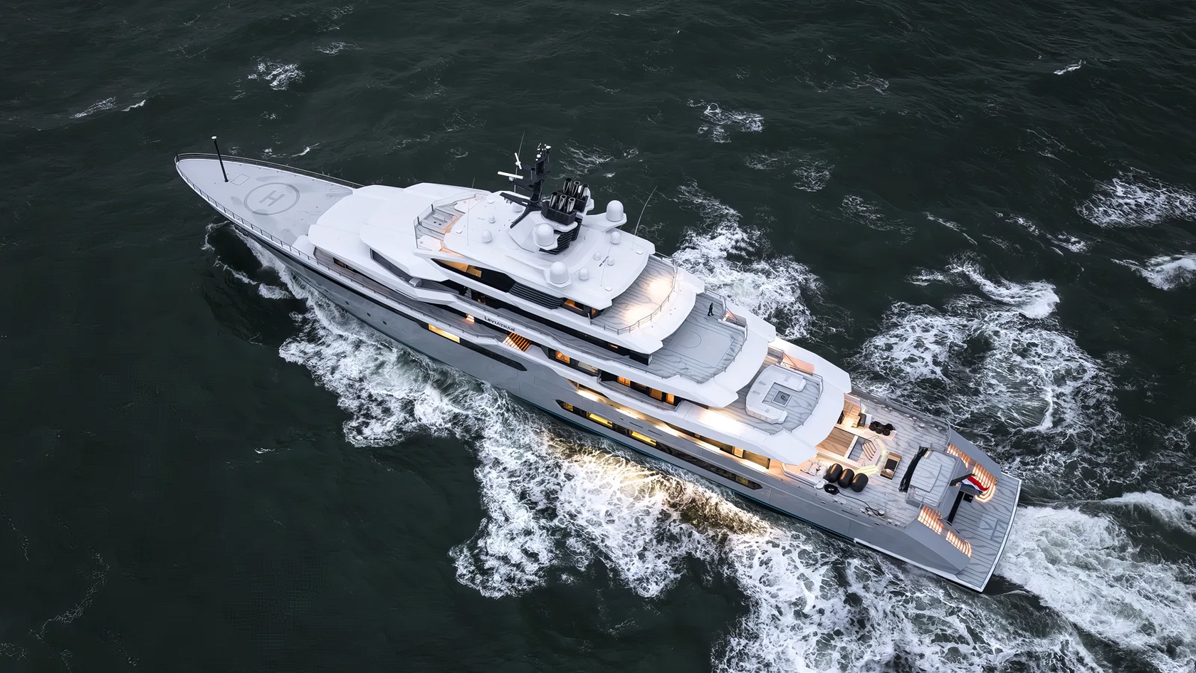 Gabe Newell's Superyacht: 5 Bold Ideas Behind Leviathan 7 Luxurious white yacht cruising through the ocean, showcasing sleek design and modern features, perfect for high-end maritime adventures and private luxury experiences.