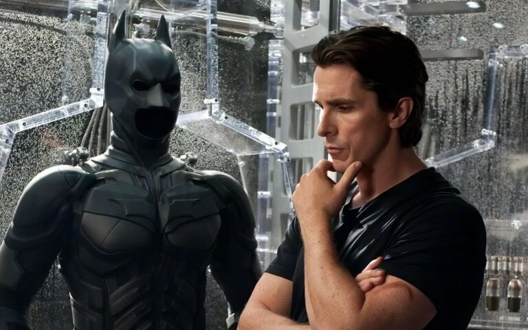 Batman-inspired costume, futuristic armor, comic book hero, cosplay, science fiction, detailed design, black armor, superhero outfit, high-tech suit, fictional character.