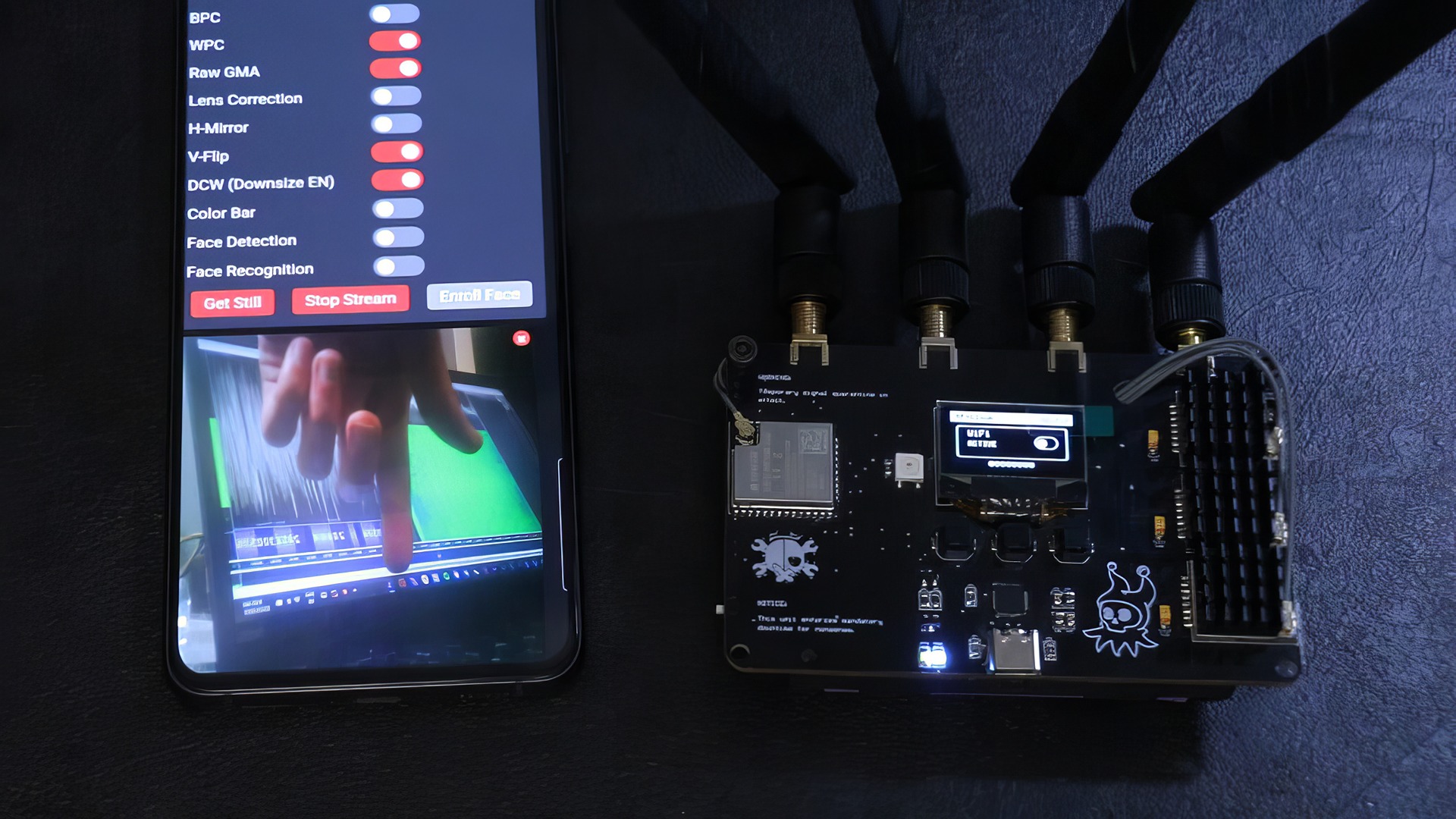 RF-Clown V2: 10 Big Upgrades for Smarter RF Hacking 6 Smartphone displaying an AI and facial recognition interface connected to a circuit board with various ports and components, showcasing innovative technology and digital security solutions.
