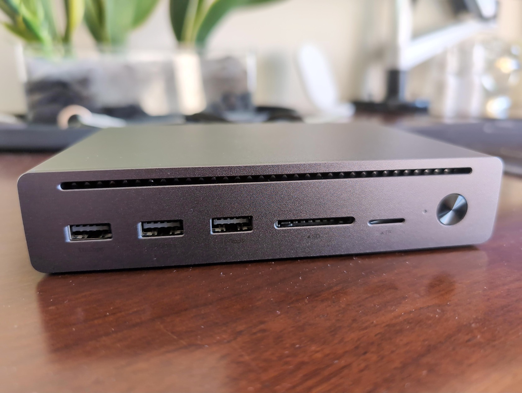 UGREEN Revodok Maxidok 10-in-1 Review: A True Thunderbolt 5 Dock 3 Close-up of UGREEN Revodok Maxidok 10-in-1 Thunderbolt 5 dock showing multiple ports on a wooden surface.