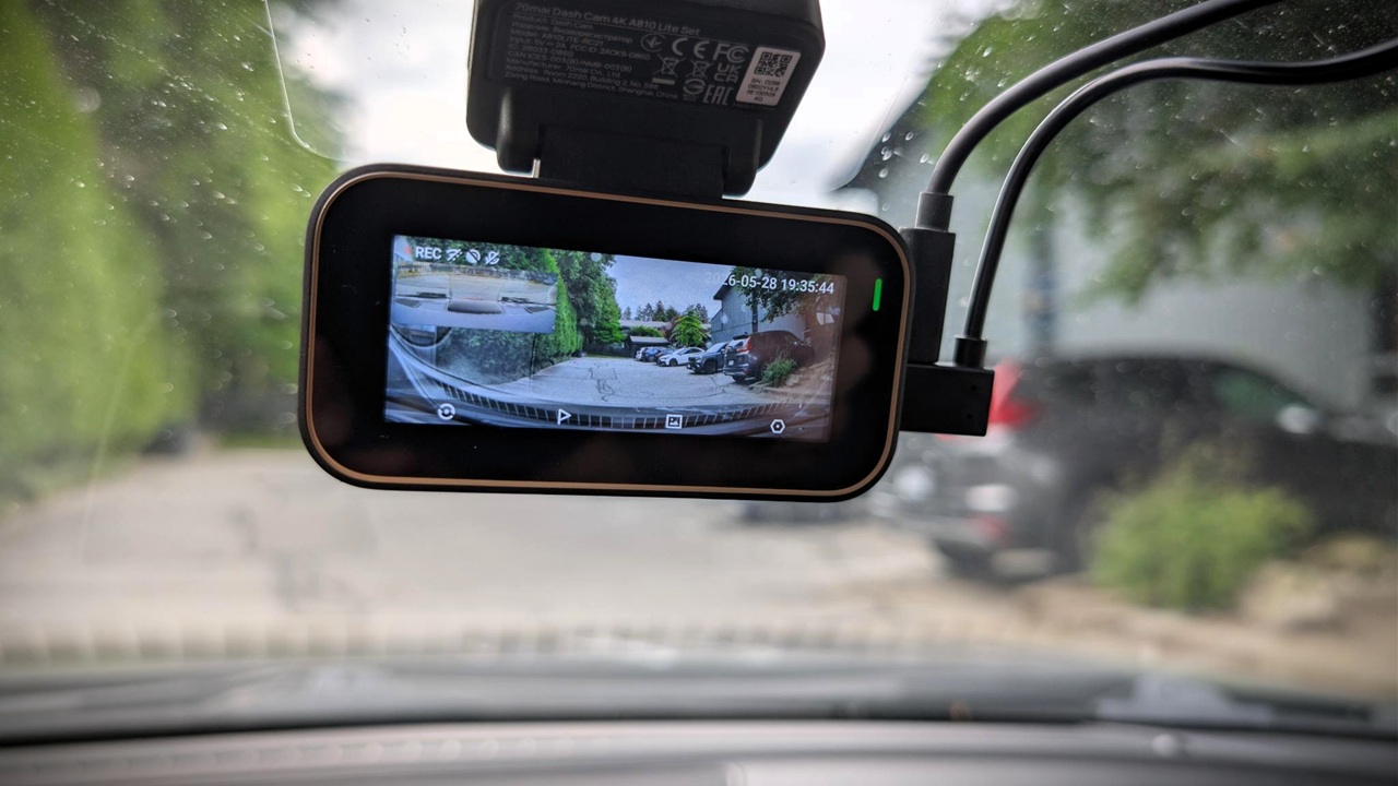 70mai A810 Lite 4K Dash Cam Review 9 Dash cam capturing road traffic, vehicles, and street scenery from inside a car during daytime.