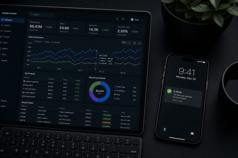 Business analytics dashboard displayed on a laptop and smartphone, showcasing data charts, graphs, and stock performance metrics for financial analysis and decision-making.