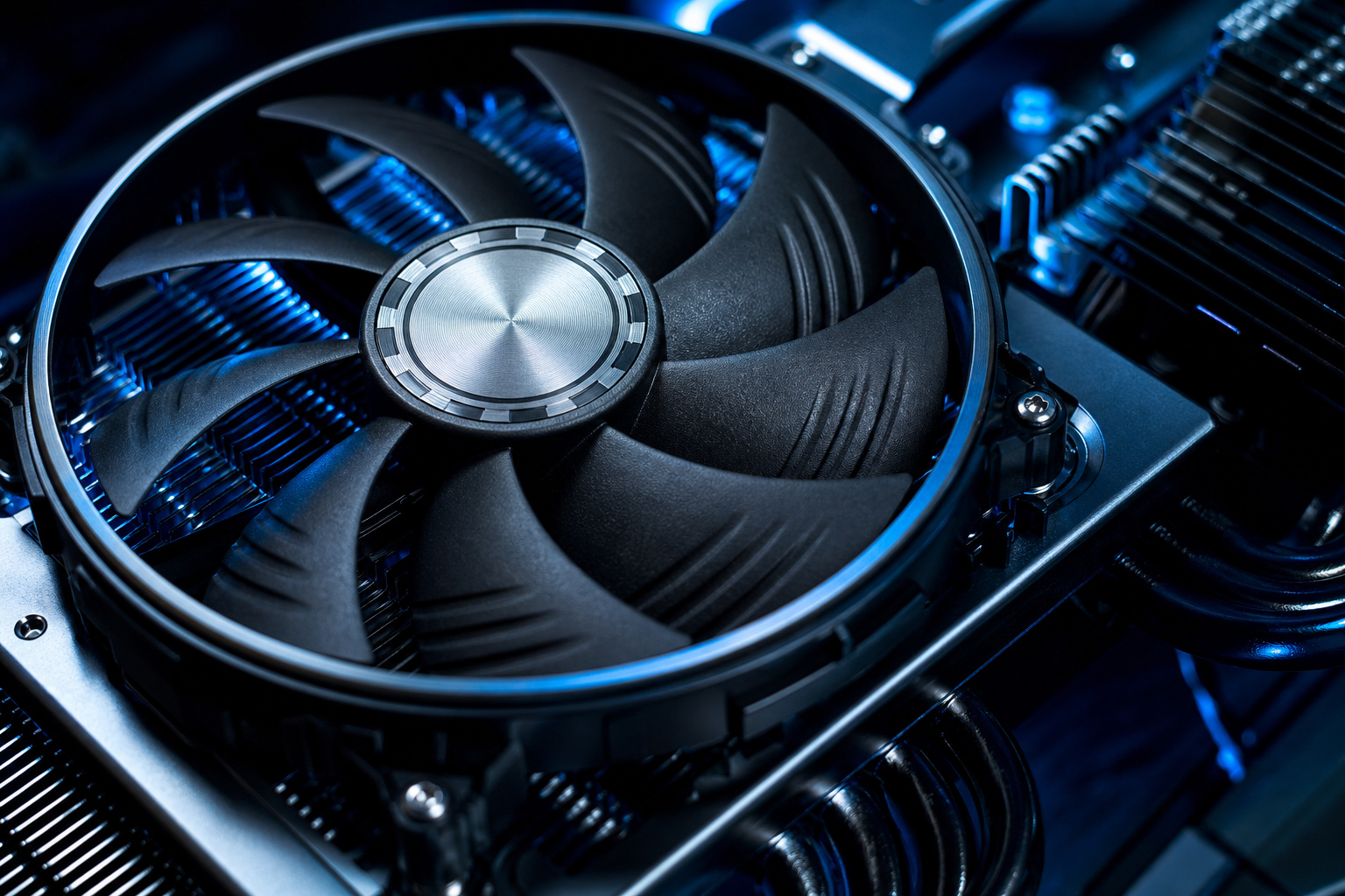 Budgeting for a Major Tech Upgrade: Strategy Over Splurge 7 Close-up of a high-performance computer cooling fan with black blades and metallic center, installed on a gaming or server motherboard for optimal airflow and heat dissipation.