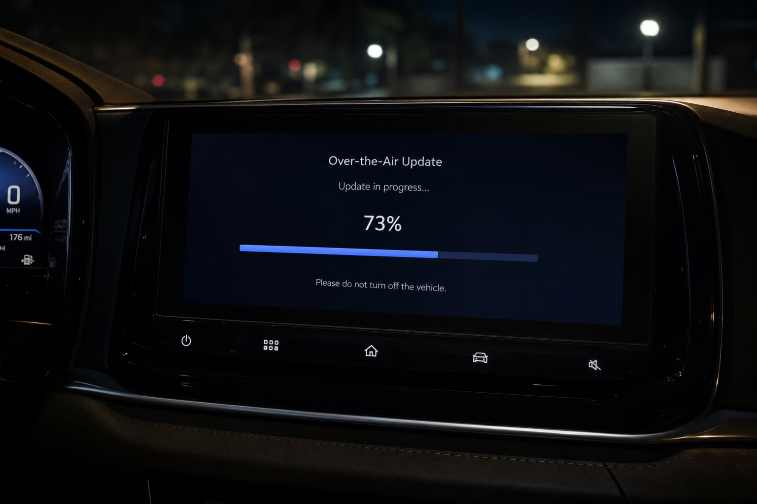 Car dashboard display showing an over-the-air update progress at 73%, with a message to not turn off the vehicle during the process.