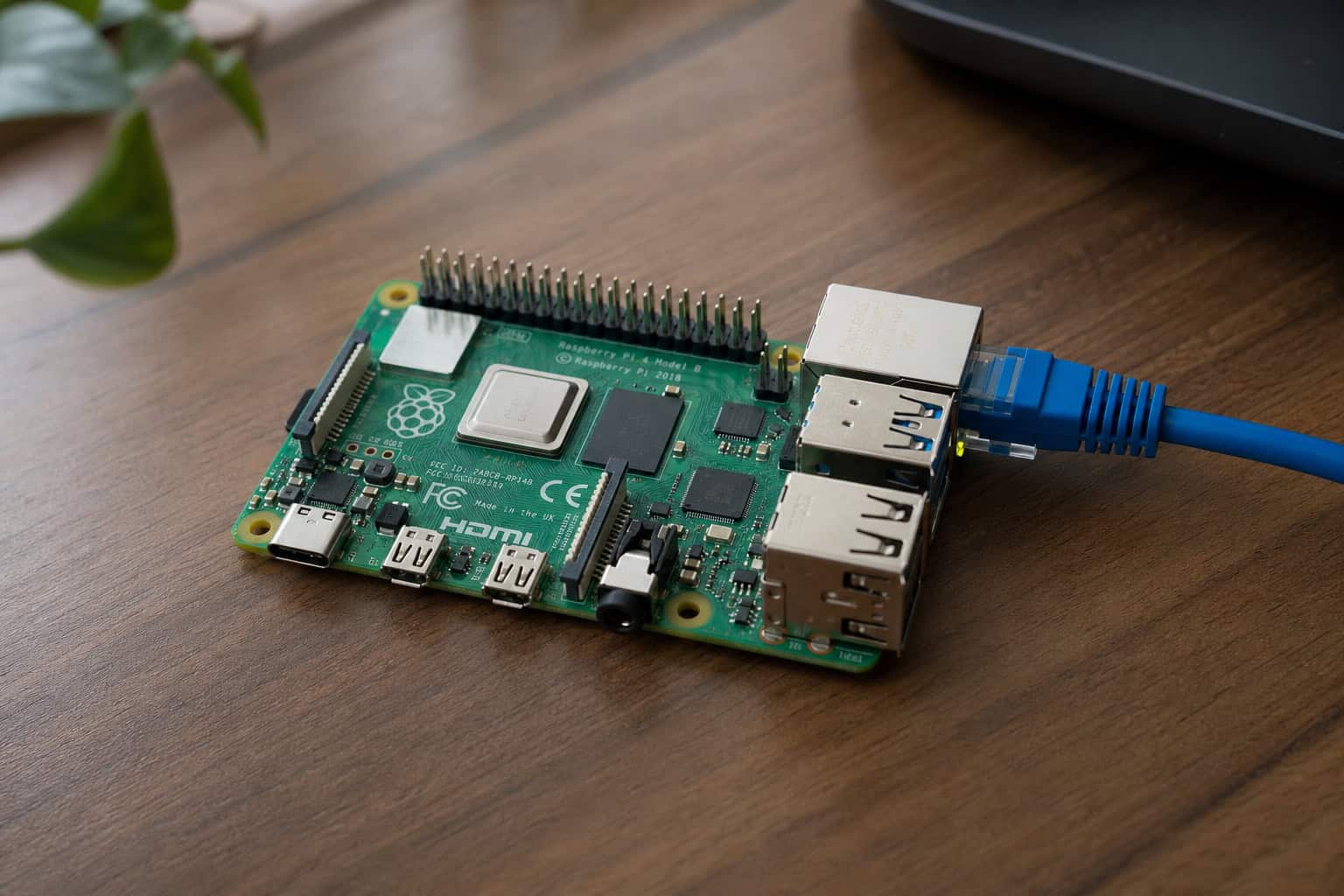 ProjectSend vs WeTransfer: Why Self-Hosted File Sharing Wins 3 Raspberry Pi 4 on a desk with ethernet cable as a self-hosted file sharing server.