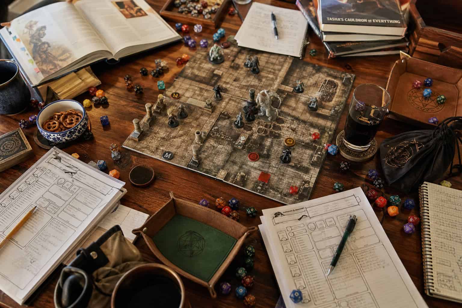 How To Make Friends As A Geek: Why Sandboxes Beat Social Mixers 2 Tabletop role-playing game setup with dice, character sheets, rulebooks, and game accessories on a wooden table.
