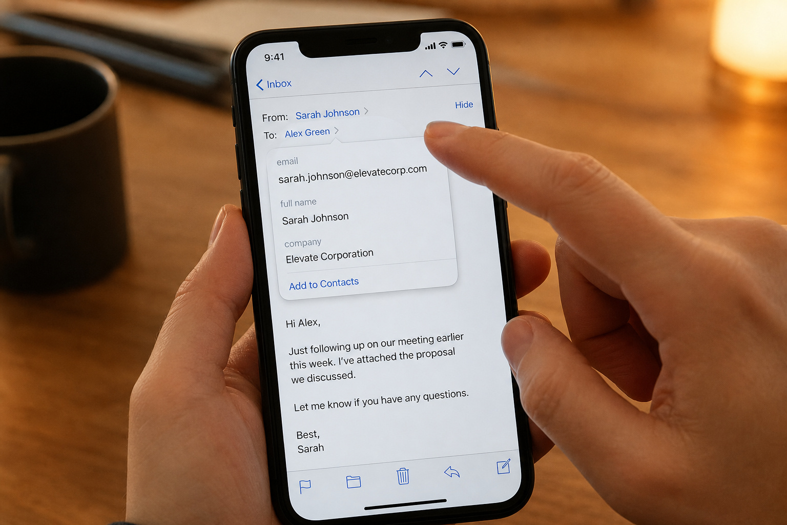 How to Tell If It's a Scammer Email: 7 Red Flags That Go Beyond the Obvious 3 Person tapping a smartphone screen to expand and verify the full sender email address.