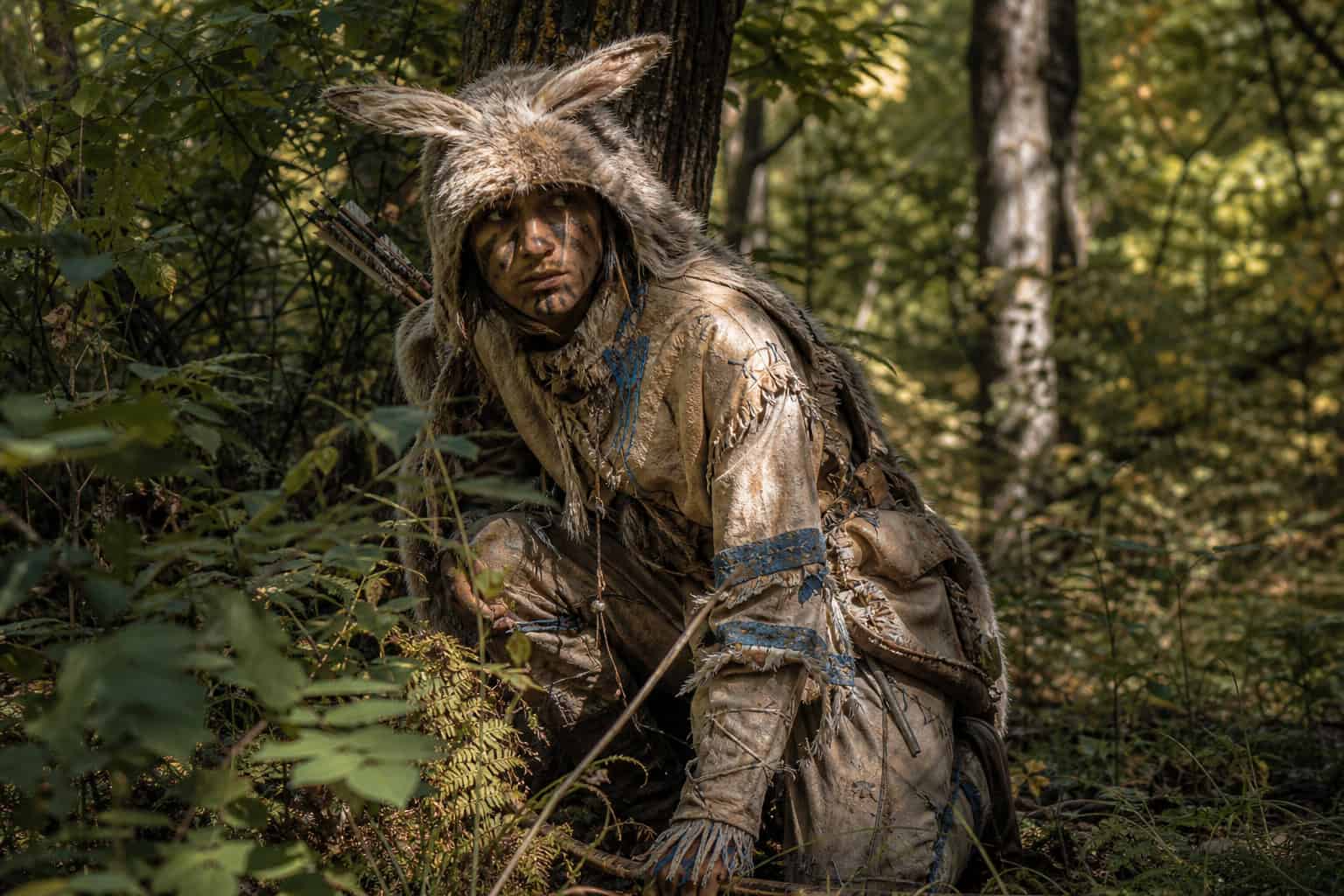 Sparrowhawk stealth outfit using sun-bleached deer hide and blue accents for forest camouflage.