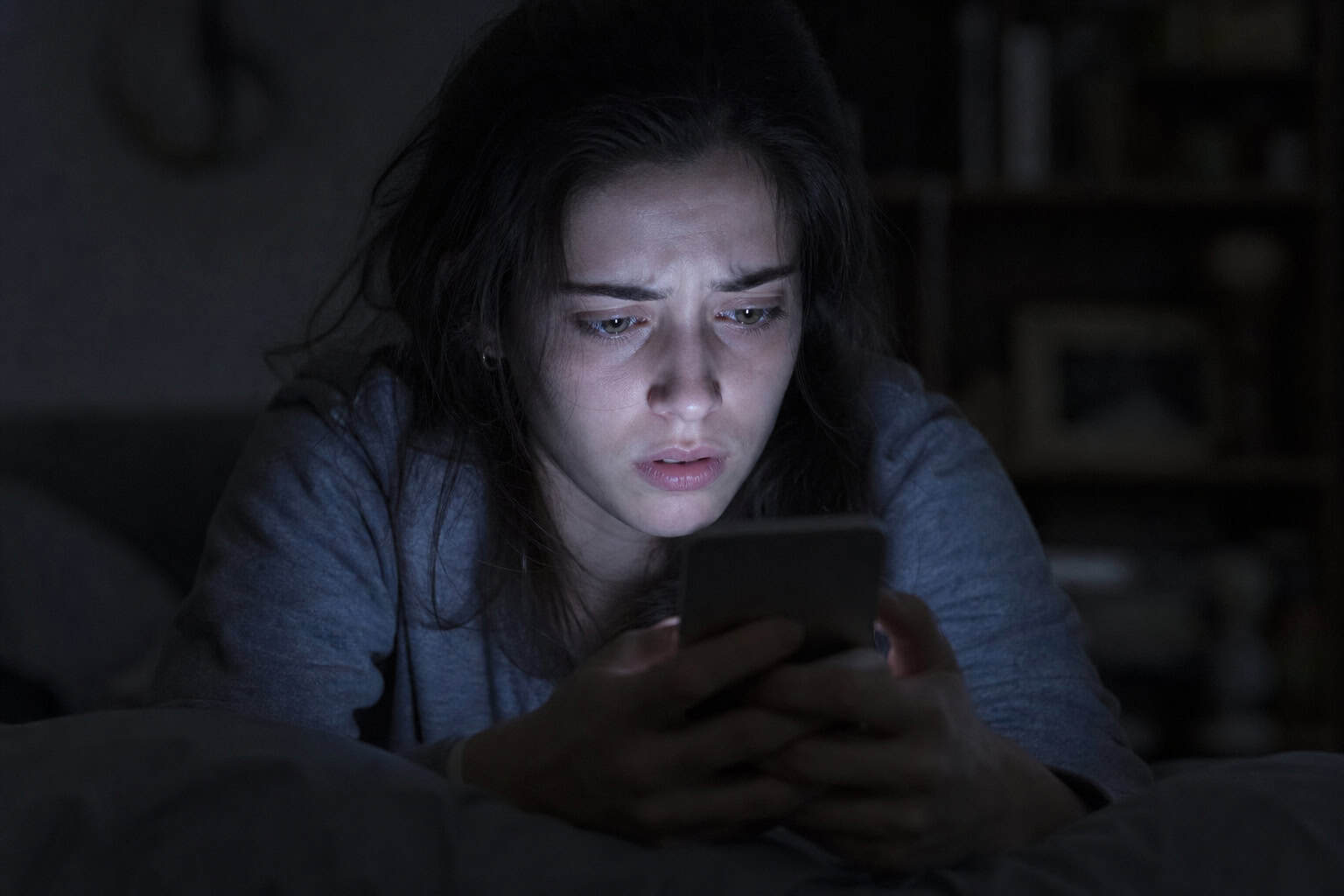 YouTube Private Video Downloader APK: Why Most Are Malware and 2 That Work 5 User anxiously looking at phone while searching for a private YouTube video downloader