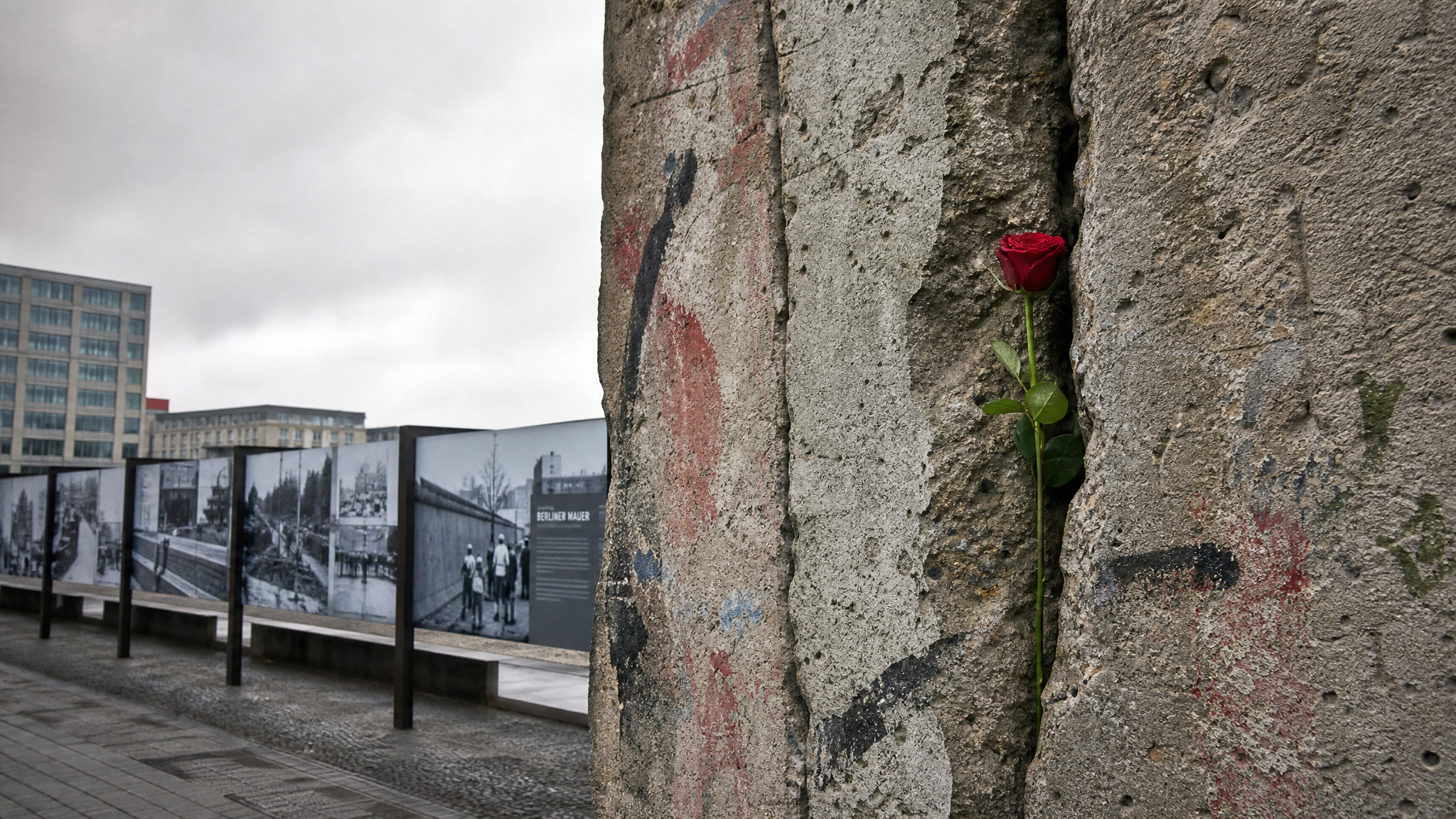 Dark-Tourism Museums: 20 Sites I've Visited That Confront Death 4 Berlin Wall memorial section with a red rose, symbolizing the division and deaths during the Cold War.