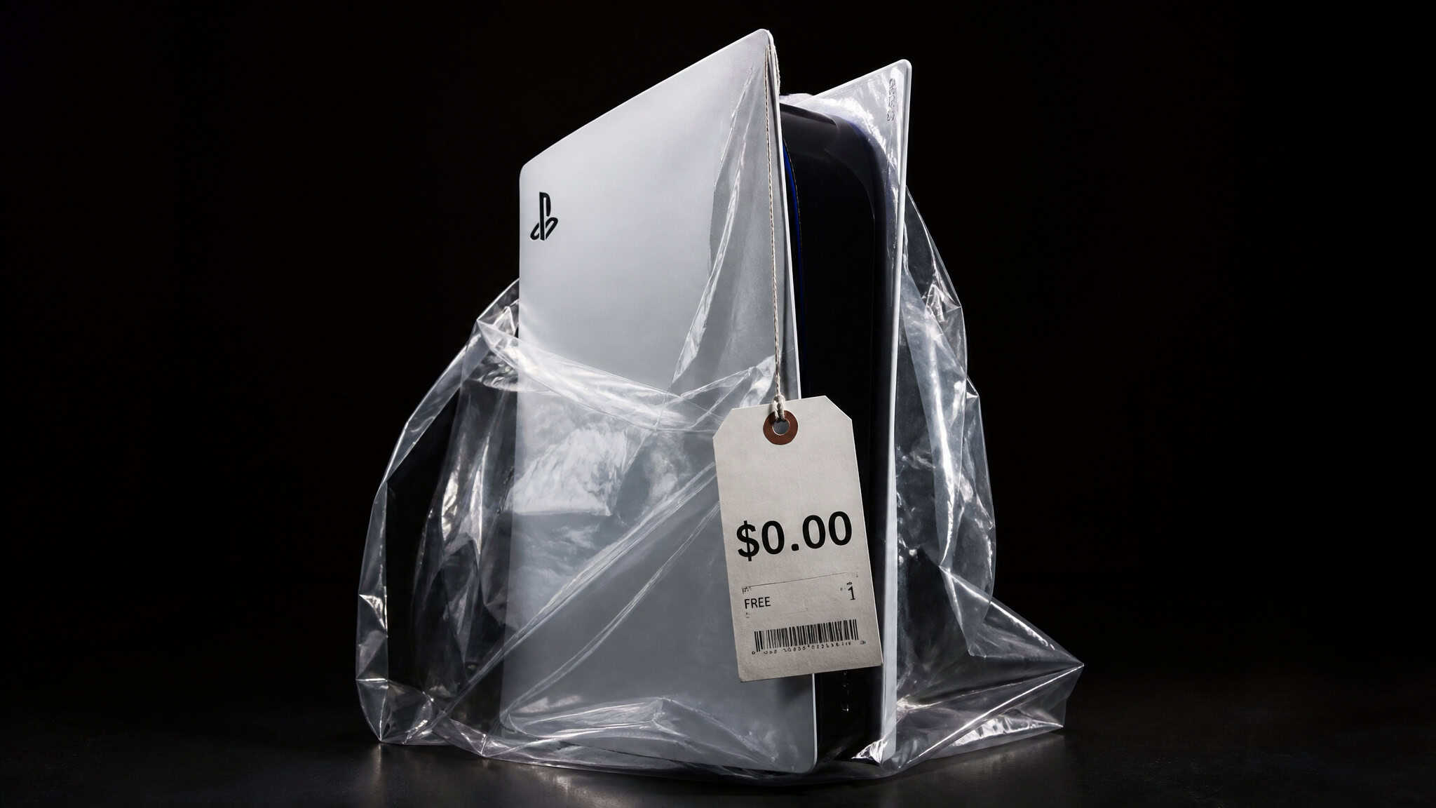 A PlayStation 5 console in clear plastic packaging with a price tag showing $0.00, highlighting a special or promotional edition.