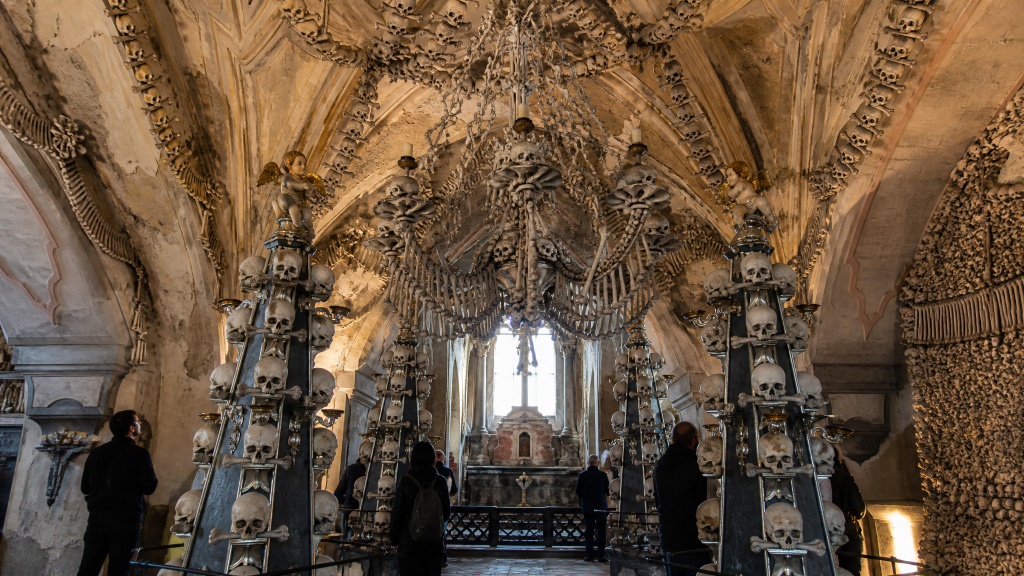 Dark-Tourism Museums: 20 Sites I've Visited That Confront Death 2 Sedlec Ossuary bone chandelier and skull-adorned walls, a canonical dark tourism site in Czechia.