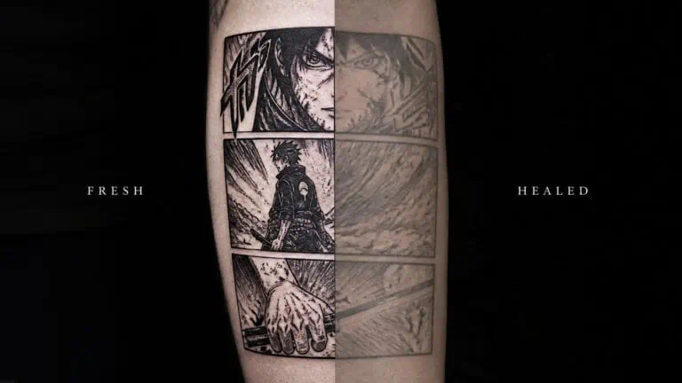 Close-up of a black and white manga-style tattoo on a person's arm, featuring detailed artwork and shading.