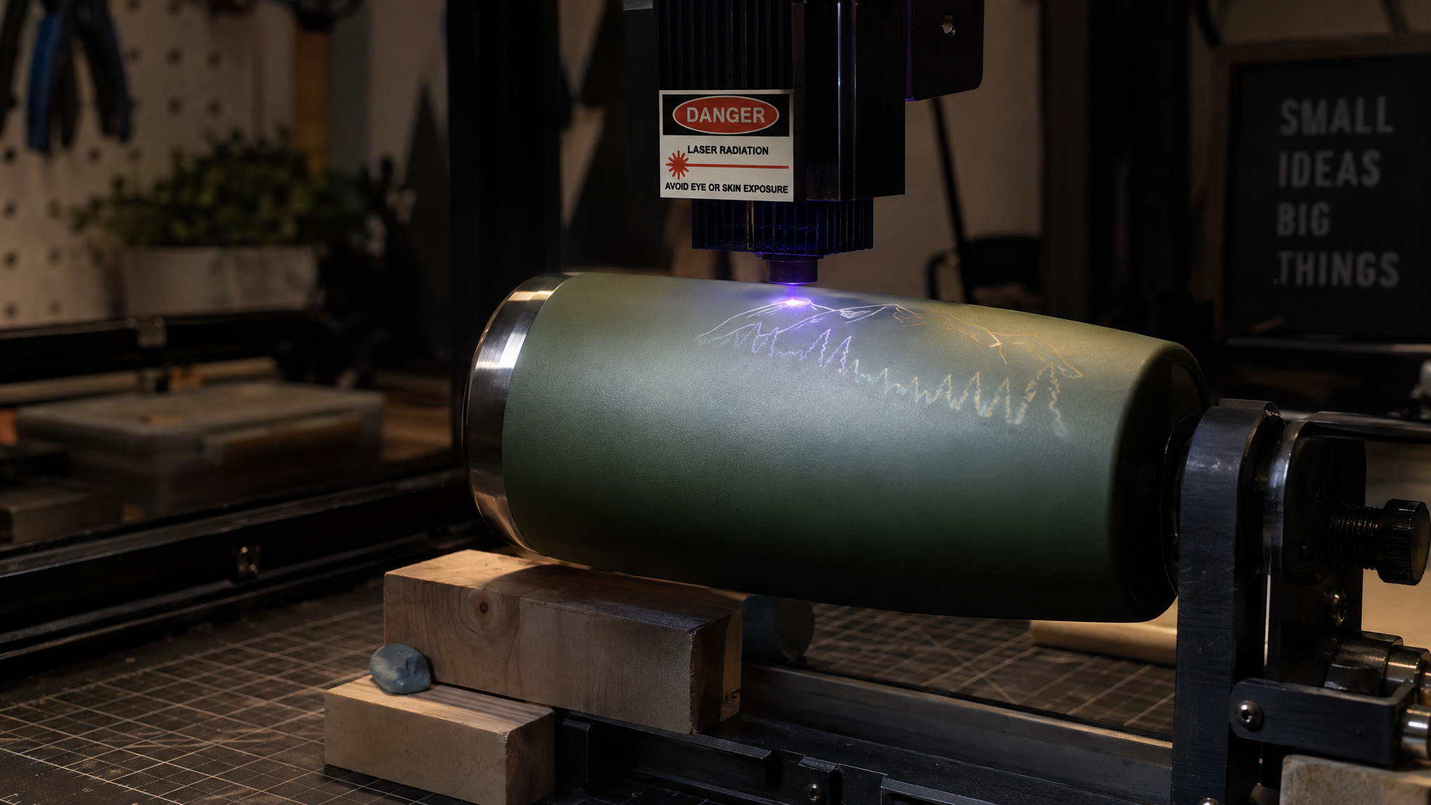 Will a 10W Laser Etch Glass? Yes — But Only With a Coating (Here's the Physics) 3 Rotary attachment spinning a coated glass tumbler under a 10W diode laser